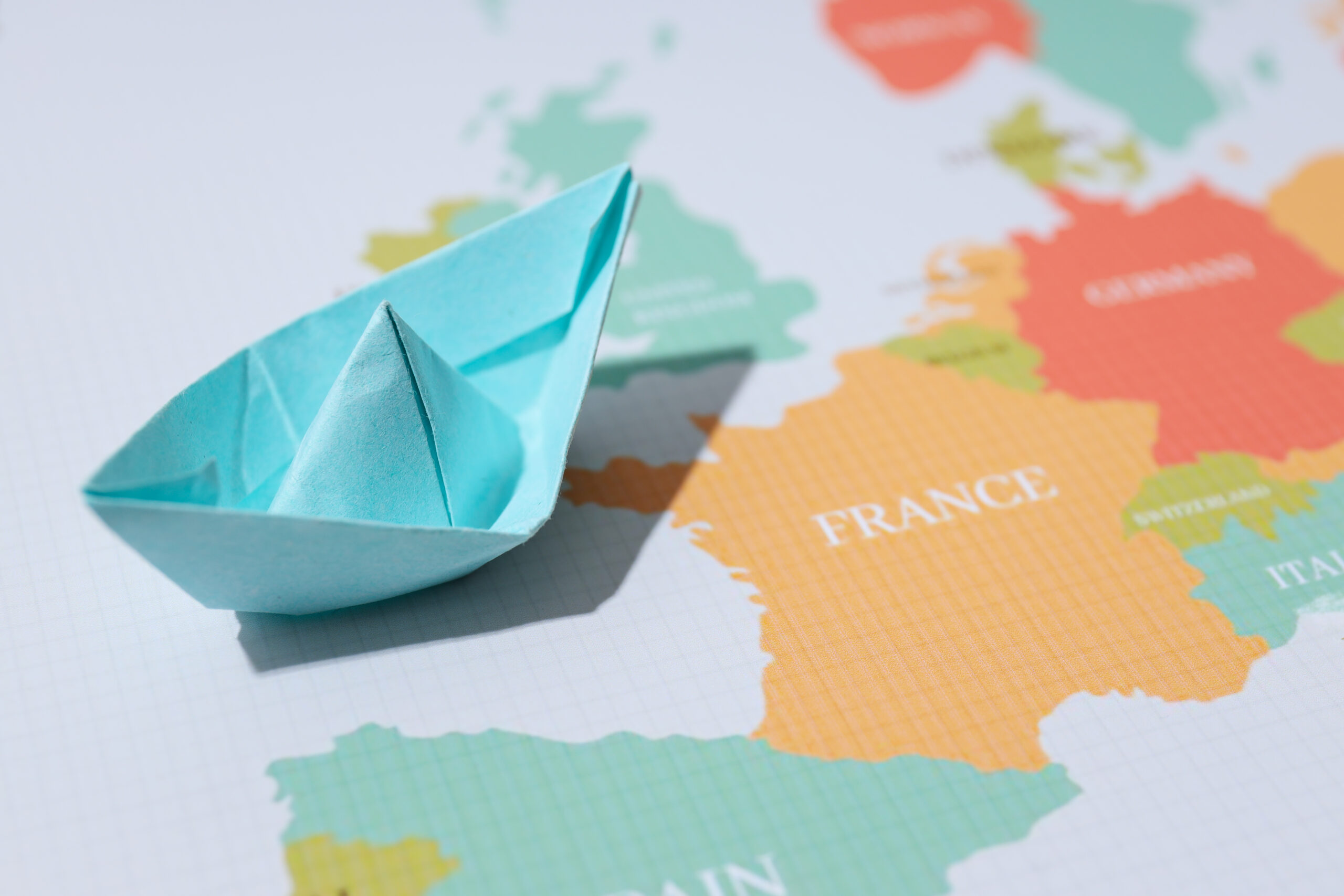 Concept of travel and adventure with paper boat